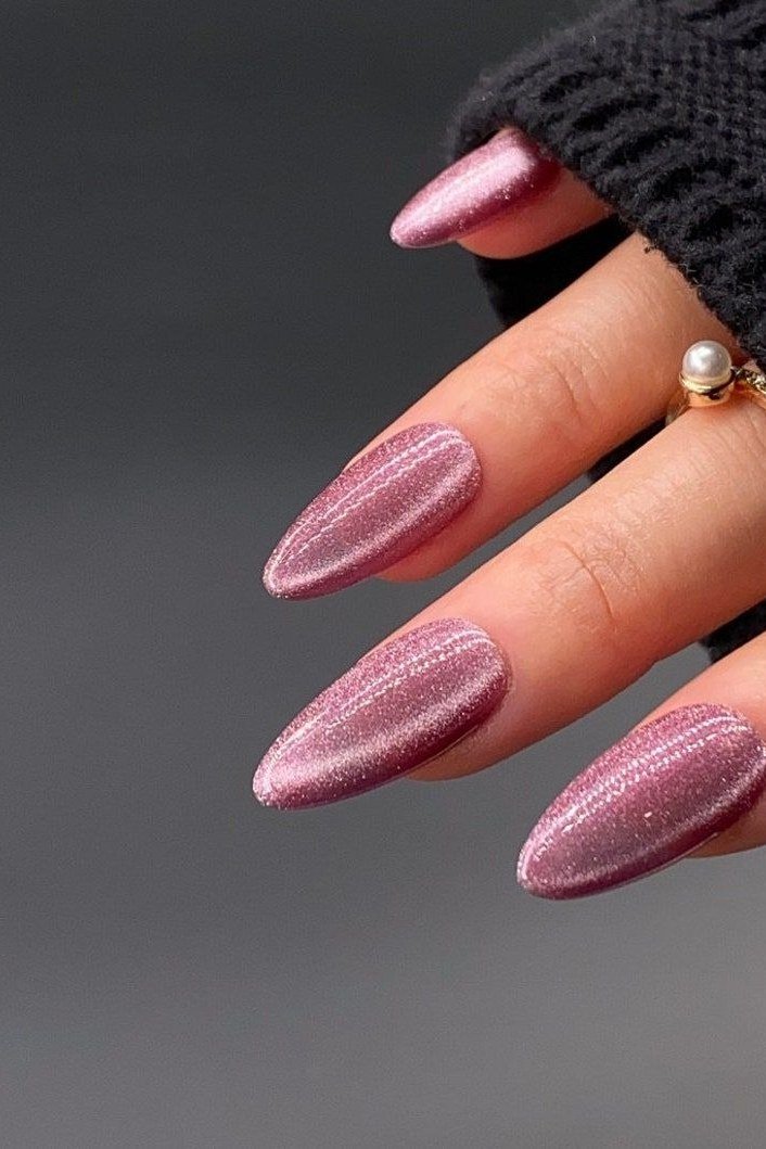 Magenta rose cat eye, long stiletto - nail ideas for women over 40