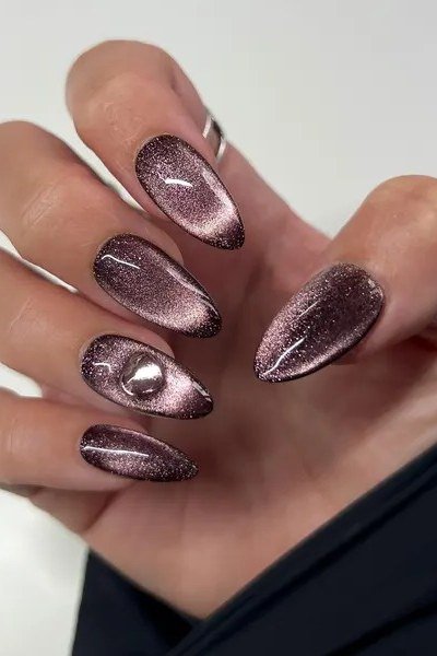 Dark chocolate cat eye, stiletto - nail ideas for women over 40