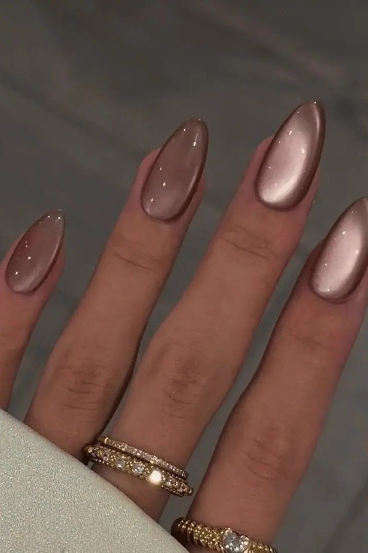 Rose gold cat eye, almond - nail ideas for women over 40