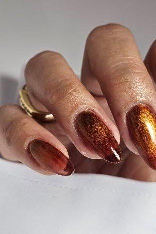 Copper cat eye, almond - nail ideas for women over 40