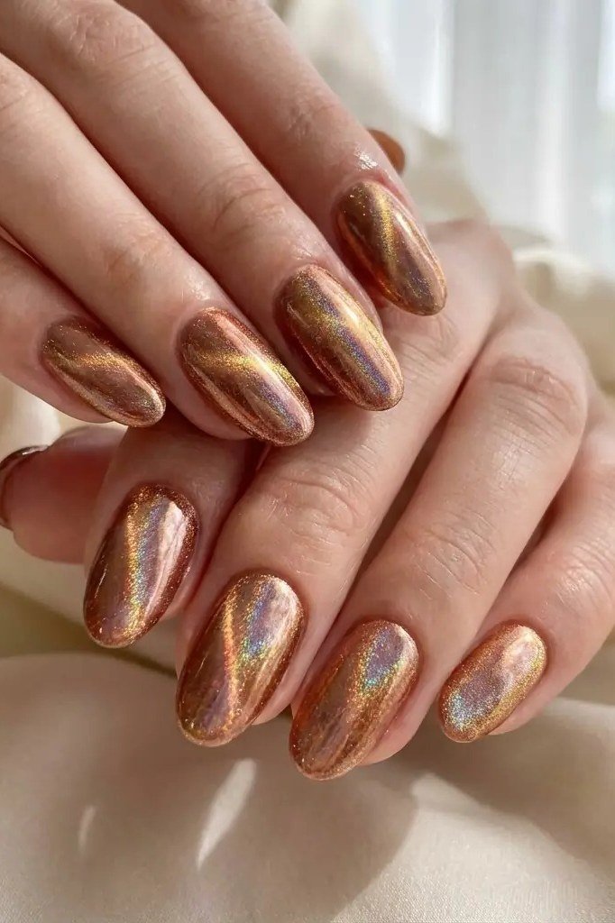Copper gold velvet cat eye, short almond, stacked hands - nail ideas for women over 40