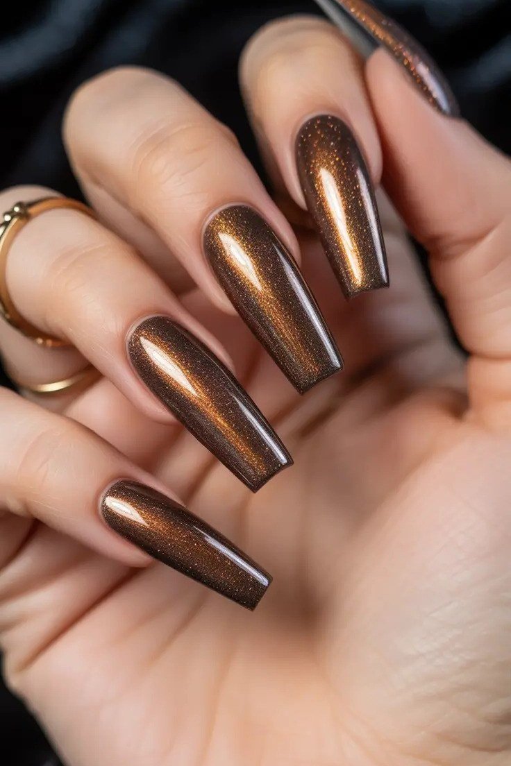 Dark chocolate copper cat eye, long coffin - nail ideas for women over 40