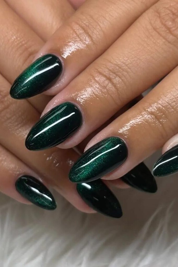 Deep emerald velvet cat eye, almond - nail ideas for women over 40