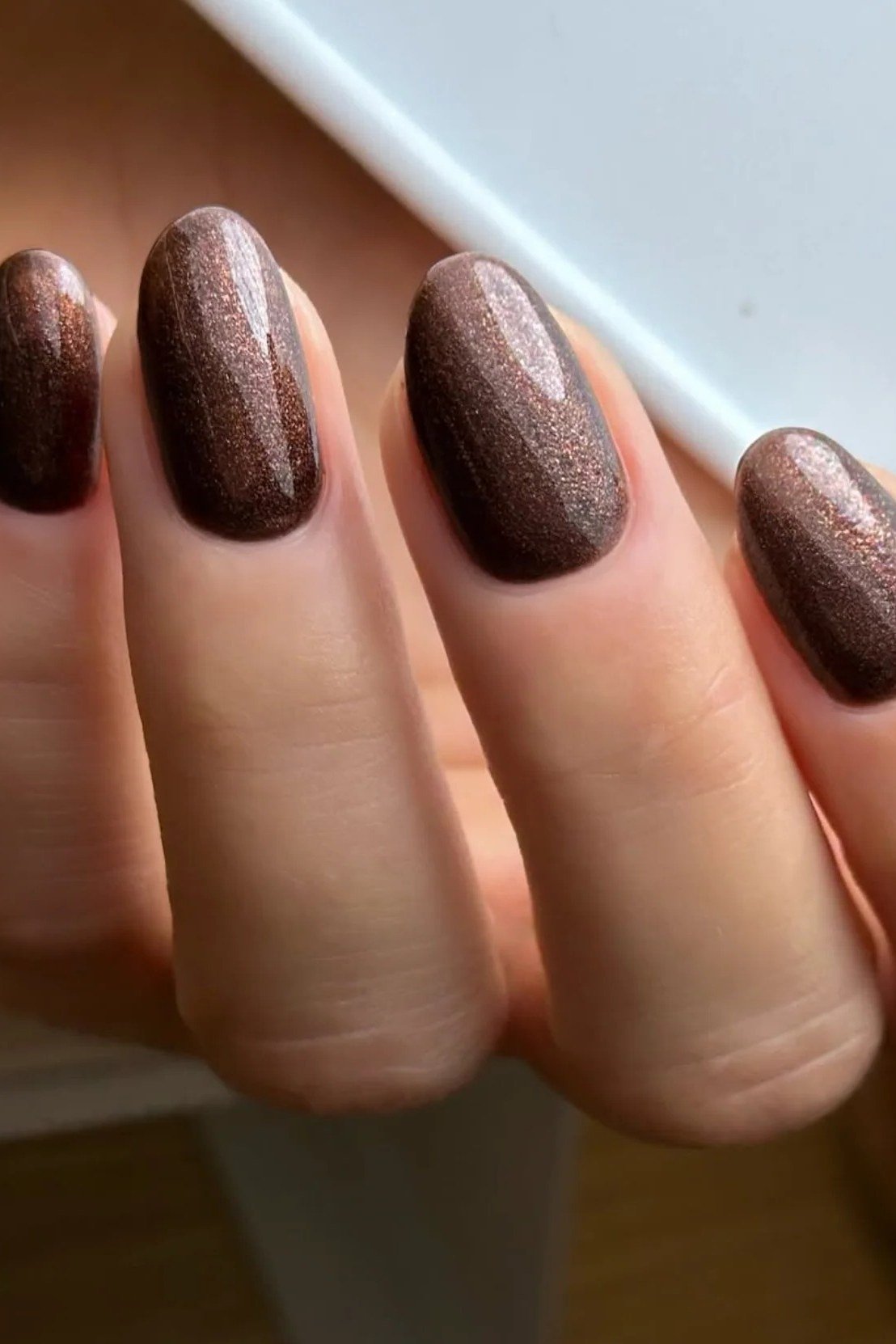 Chocolate brown velvet cat eye, almond - nail ideas for women over 40