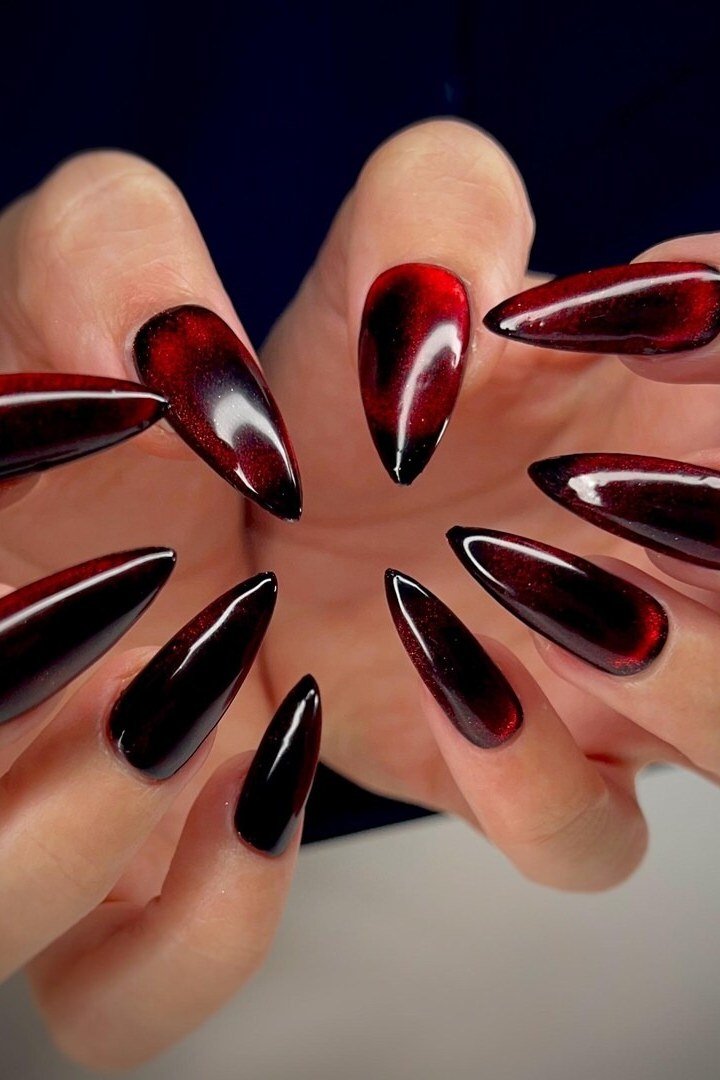 Black cherry to red velvet cat eye, stiletto - nail ideas for women over 40