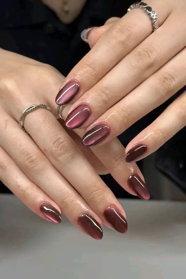 Burgundy cherry velvet cat eye, oval, two hands - nail ideas for women over 40