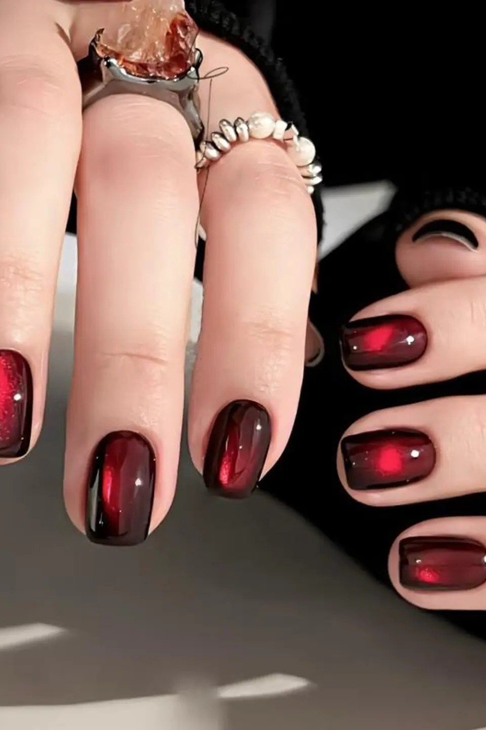 Black cherry red velvet cat eye, oval - nail ideas for women over 40