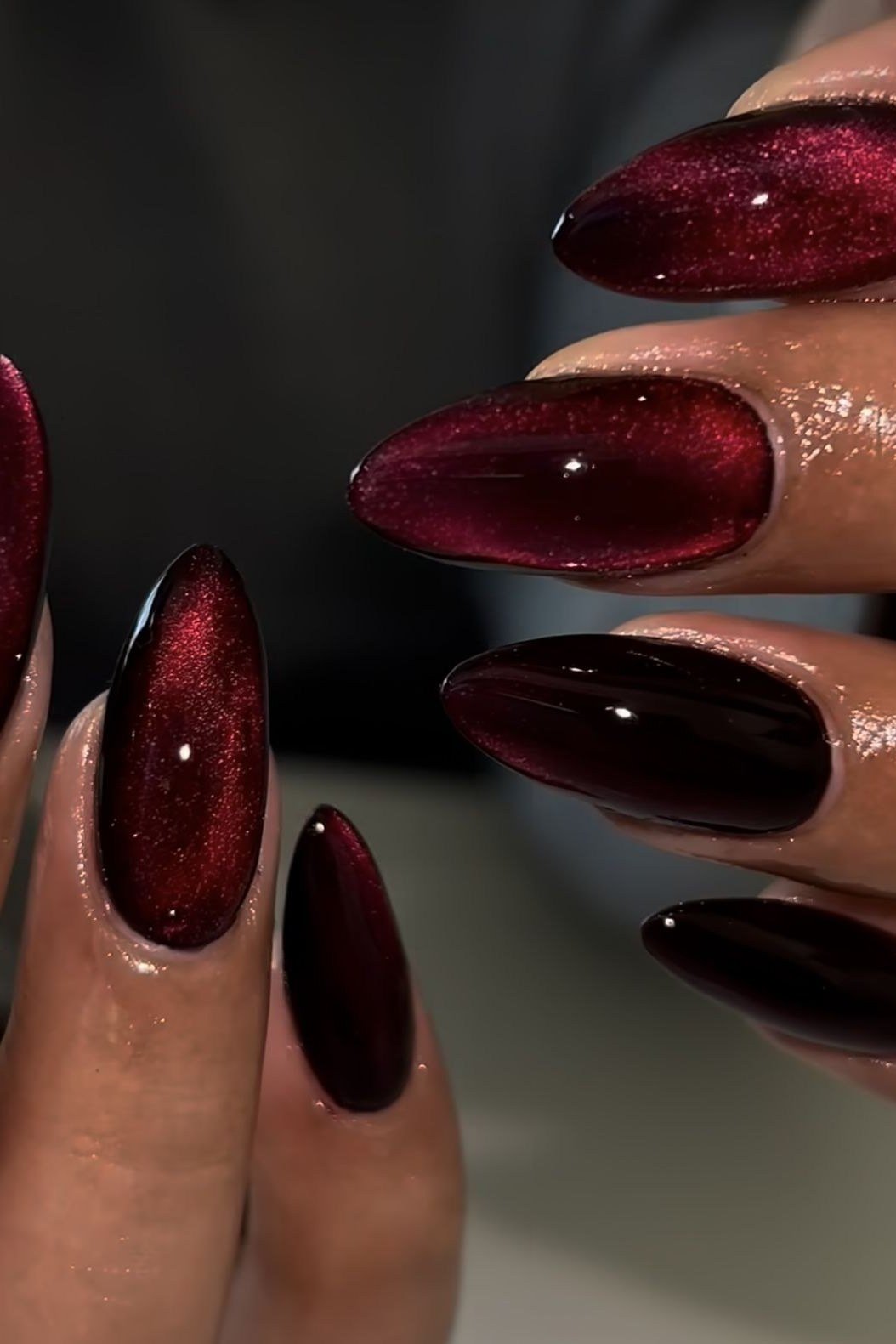 Black cherry velvet cat eye, almond, close-up - nail ideas for women over 40