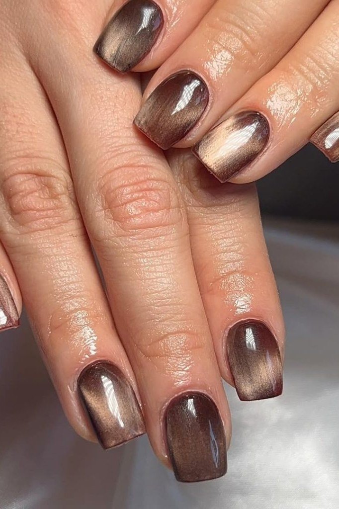 Chocolate bronze cat eye almond, warm shimmer - nail ideas for women over 40