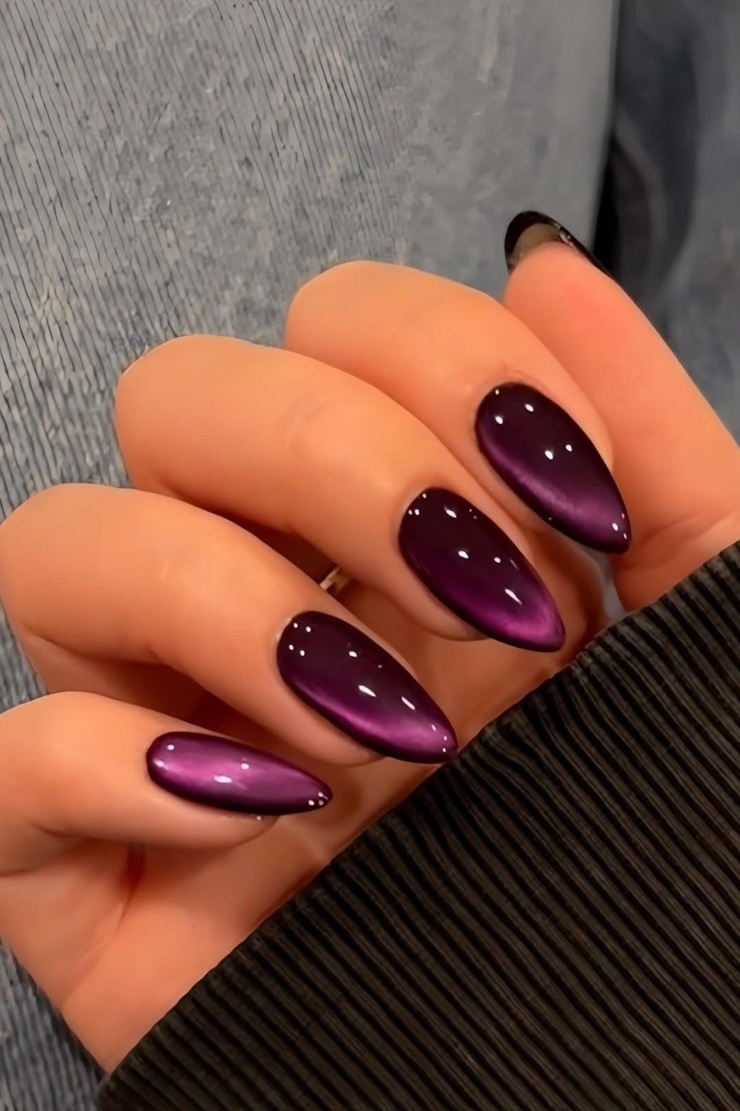 Deep plum velvet almond, glossy cat eye band - nail ideas for women over 40
