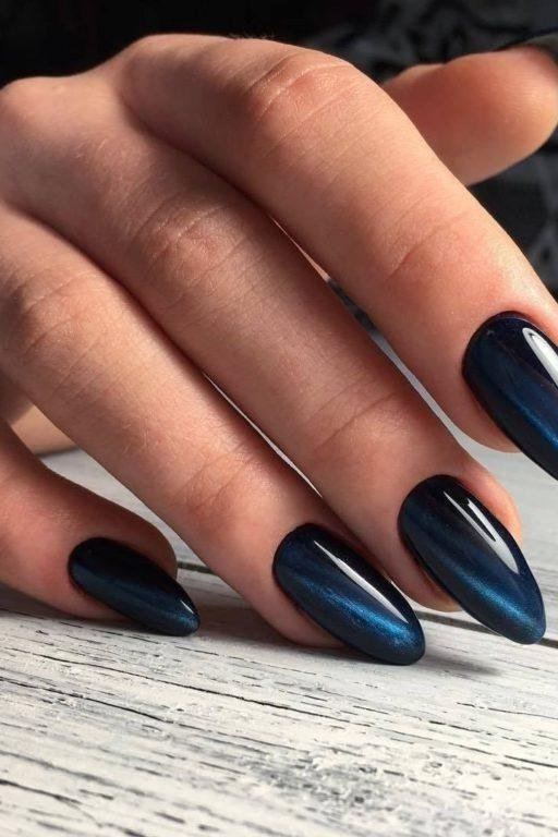 Midnight navy velvet almond, soft cat eye sheen - nail ideas for women over 40