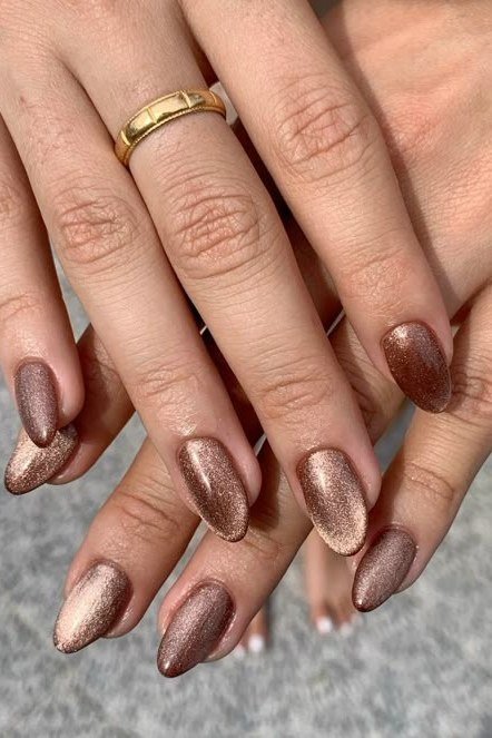 Copper bronze cat eye almond, glossy metallic shimmer - nail ideas for women over 40