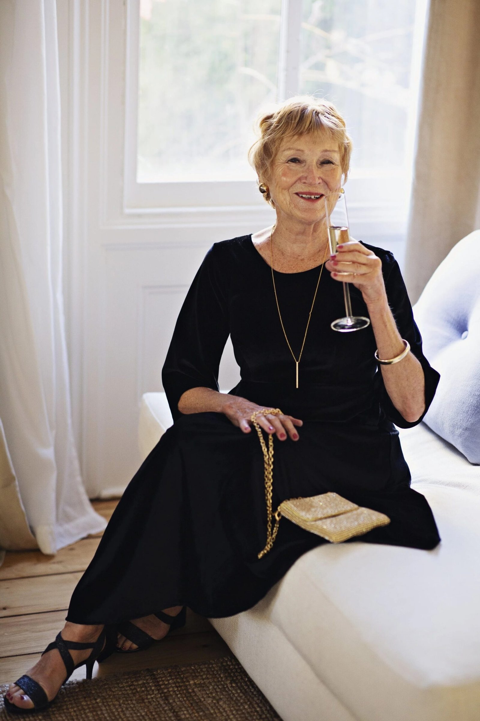 Black Velvet Midi with Champagne Flute - velvet evening outfit for women over 60