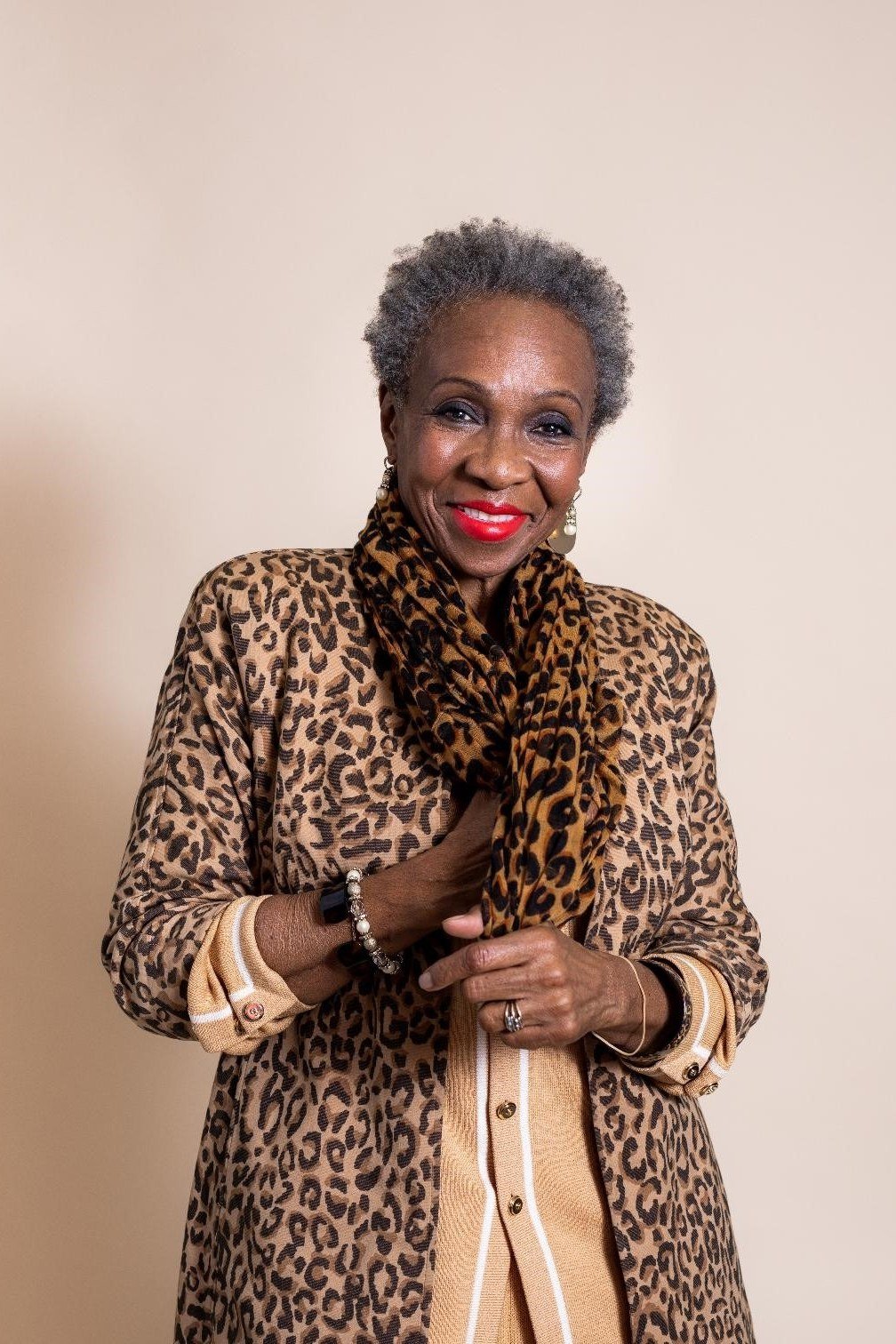 Winter outfit idea 54 for women over 60: leopard coat, studio portrait