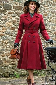 Winter outfit idea 60 for women over 60: red vintage coat with green hat and bicycle