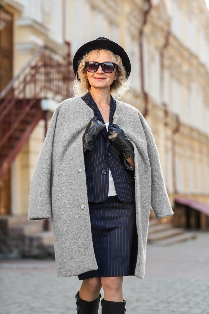 Winter outfit idea 63 for women over 60: grey coat with pinstripe skirt and beret