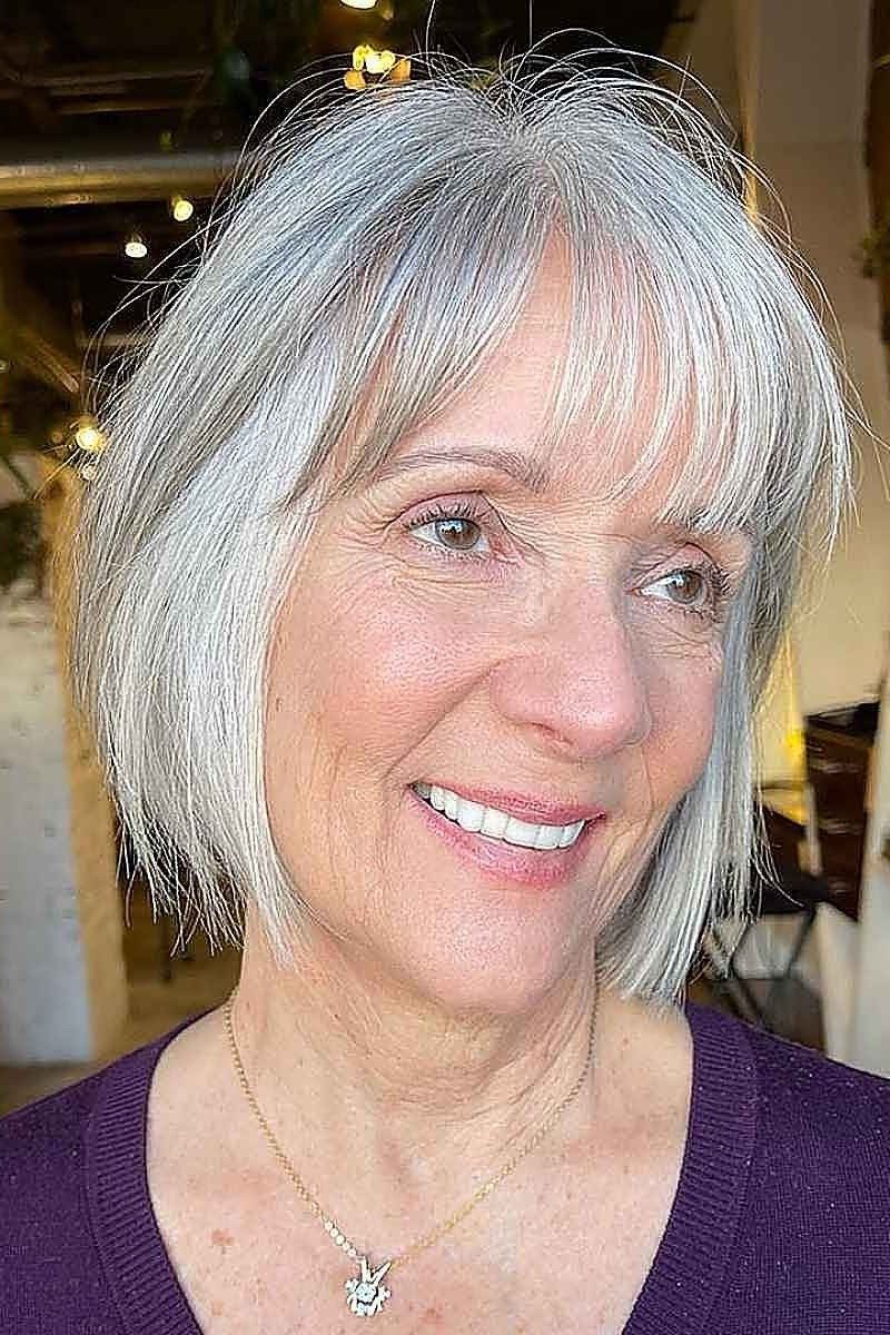 Silver sleek layered bob, front view, older - voluminous layered bob hairstyle for women over 50