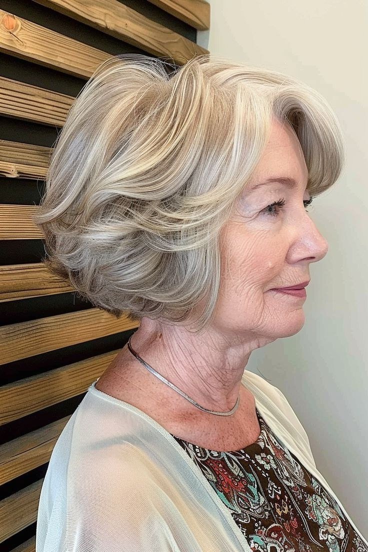 Silver layered bob, side view, mature - voluminous layered bob hairstyle for women over 50