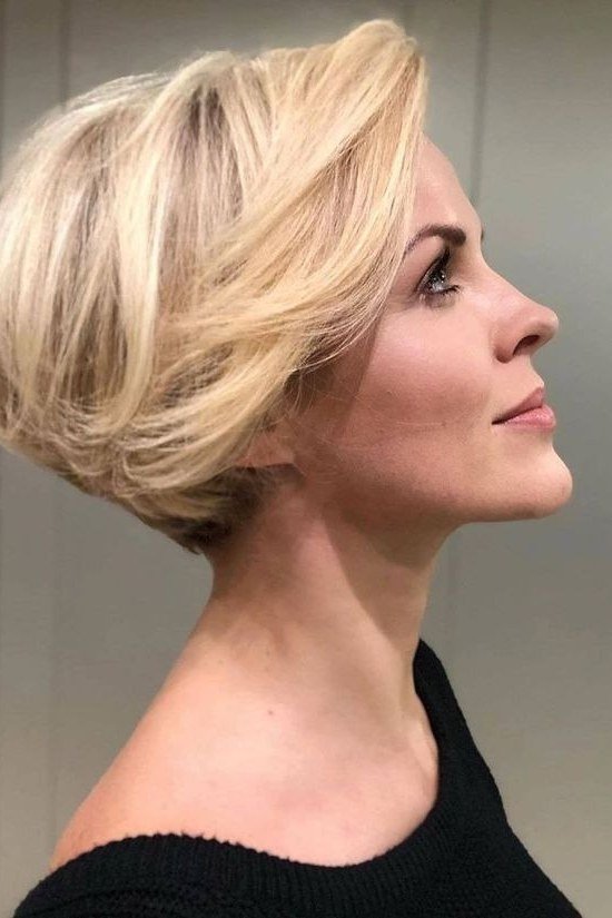 Blonde rounded layered bob, side view - voluminous layered bob hairstyle for women over 50