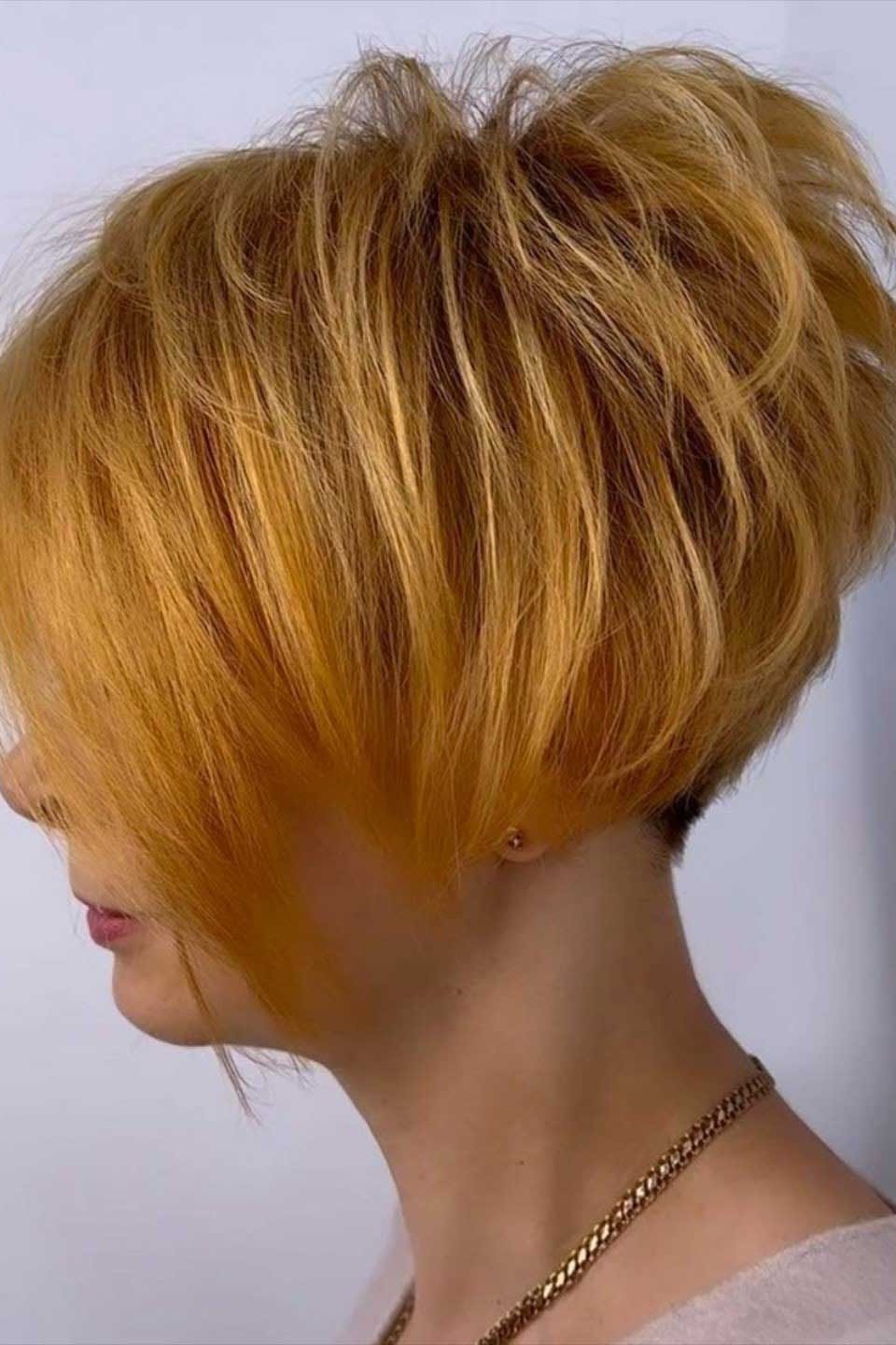 Copper-orange layered bob, side view, mature - voluminous layered bob hairstyle for women over 50
