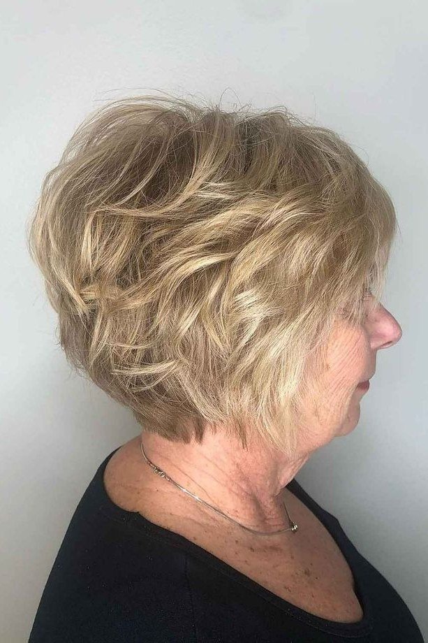 Curly blonde layered bob, side view, mature - voluminous layered bob hairstyle for women over 50