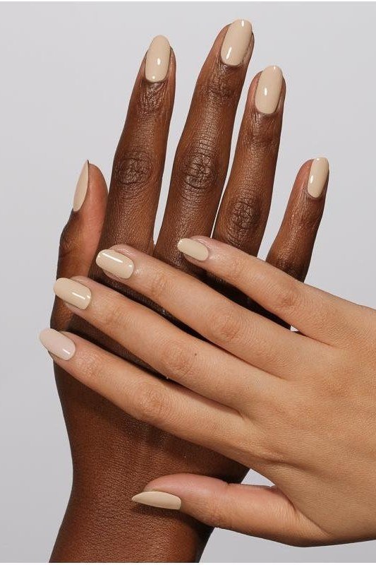 Nude almond nails on deep skin for women over 50