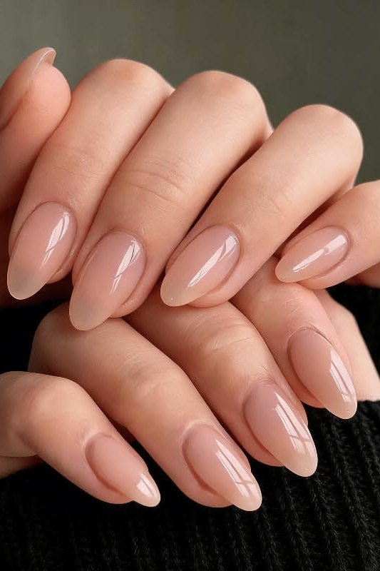 Soft pink beige nude short oval nails for women over 50