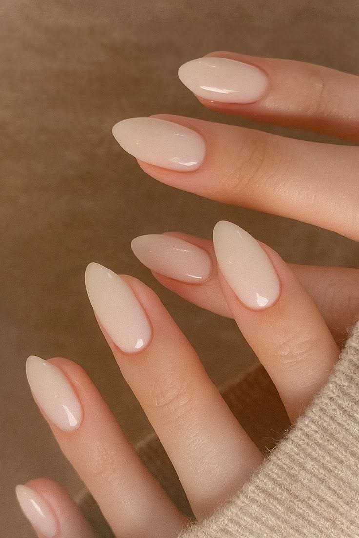 Pale nude short almond nails for women over 50