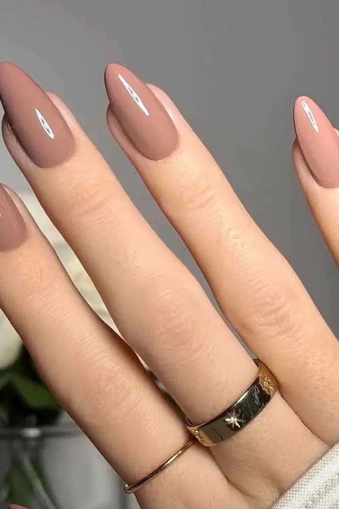 Mauve nude long almond nails for women over 50