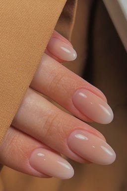 Sheer nude short almond nails for women over 50