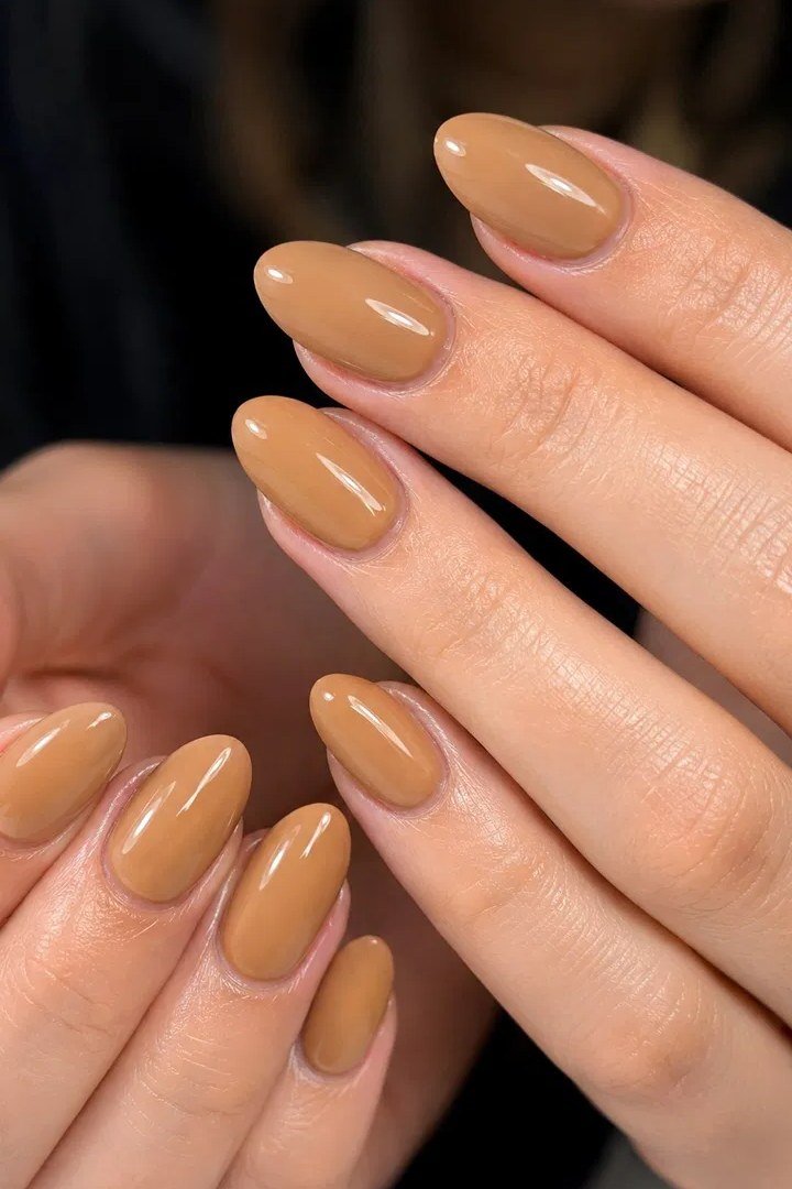 Golden caramel nude almond nails for women over 50