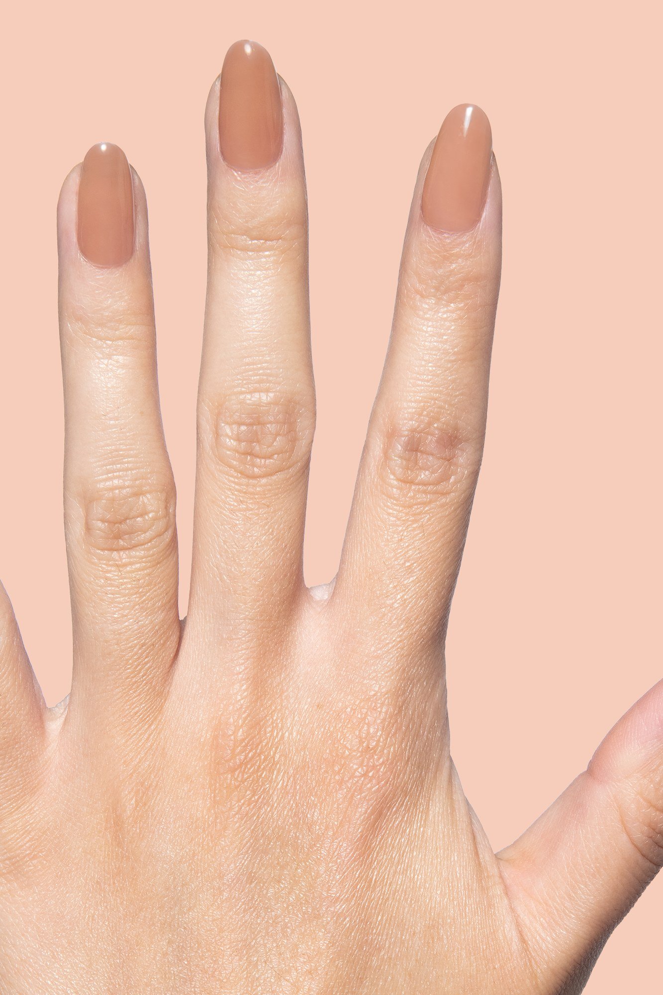 Nude short almond nails for women over 50