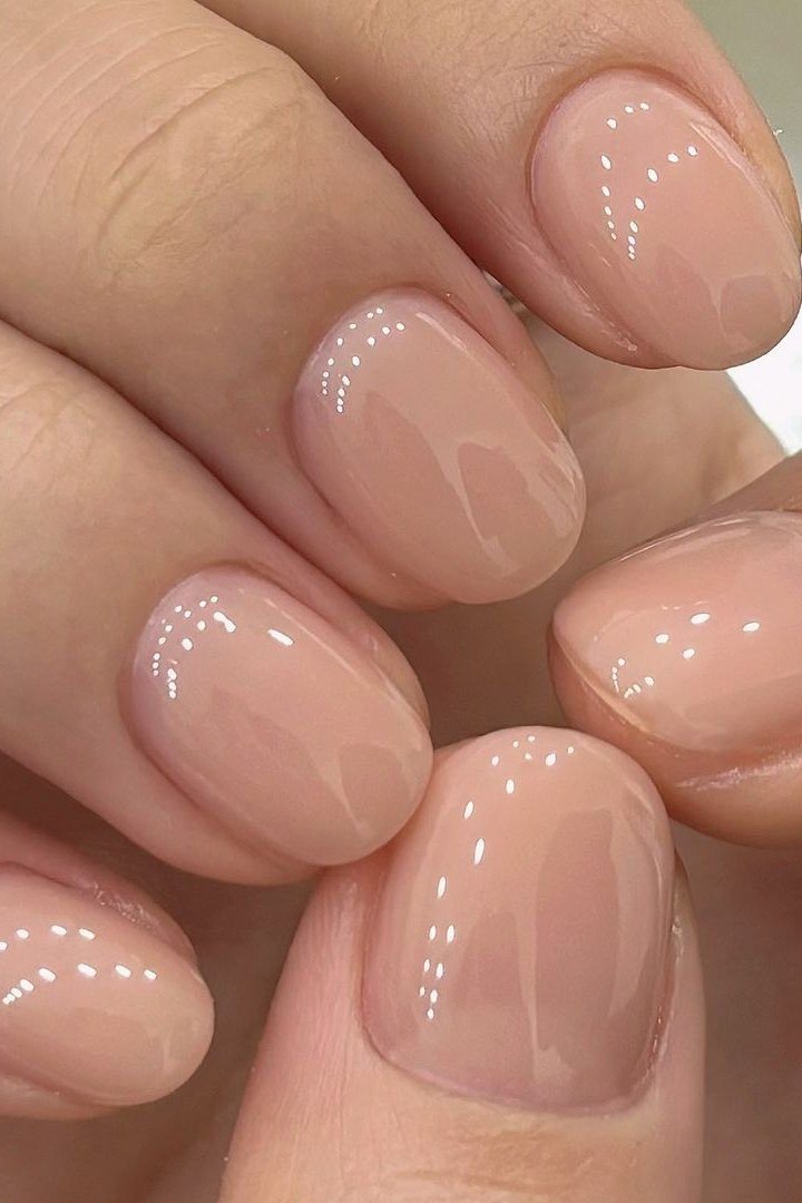 Glossy pink nude short squoval close up for women over 50