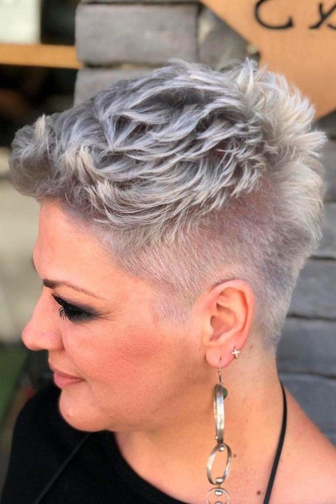 Spiky silver undercut pixie, side view, long earring - wash and wear haircut for women over 60