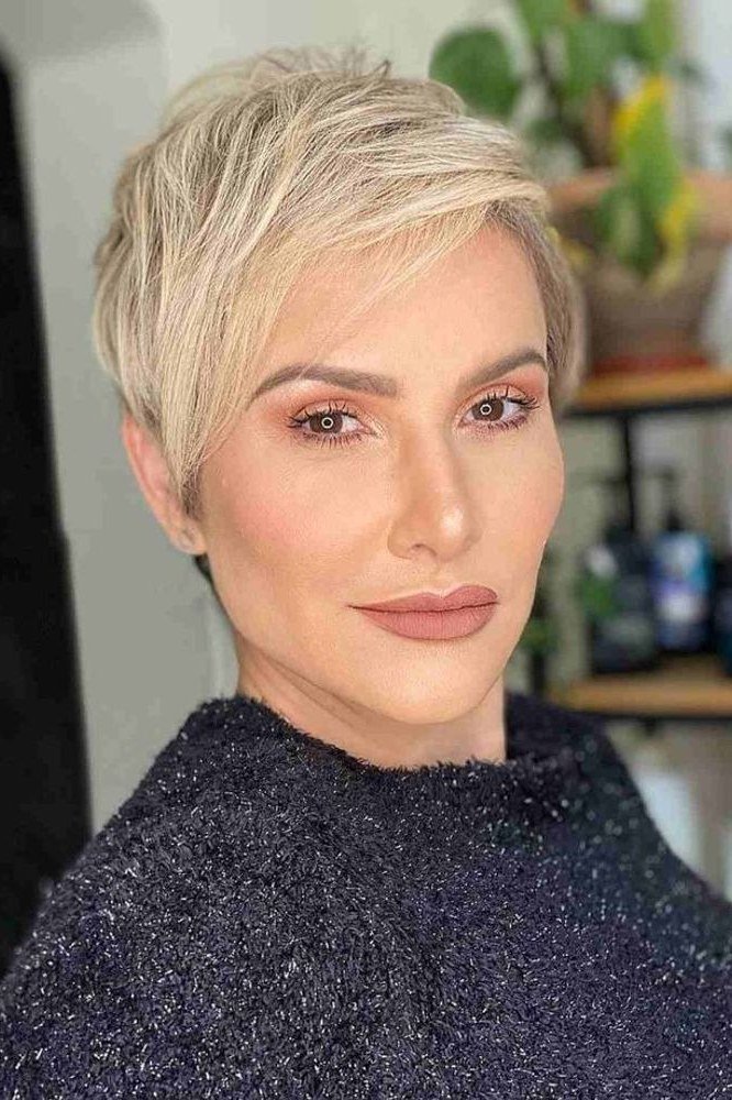 Blonde pixie, front, dark sweater - wash and wear haircut for women over 60