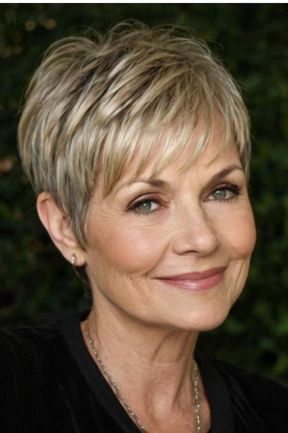 Blonde layered pixie, front, outdoor greenery - wash and wear haircut for women over 60