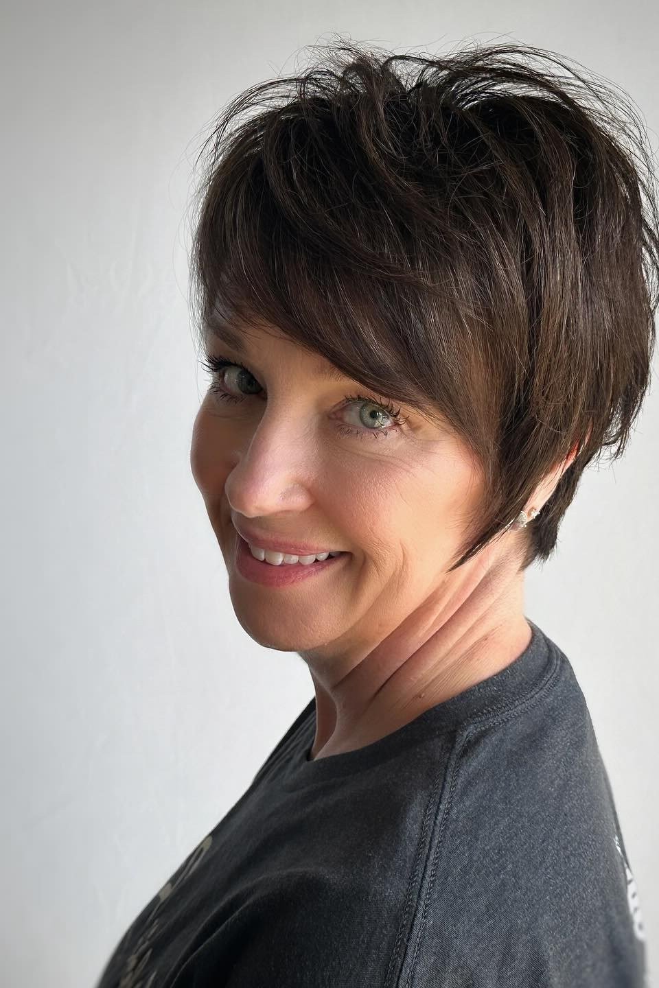 Dark pixie, front, grey tee - wash and wear haircut for women over 60
