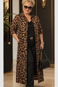 Chic business casual look for women over 50: leopard print coat over black top and trousers