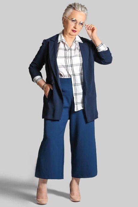 Navy business casual outfit for women over 50 with plaid shirt and wide culottes