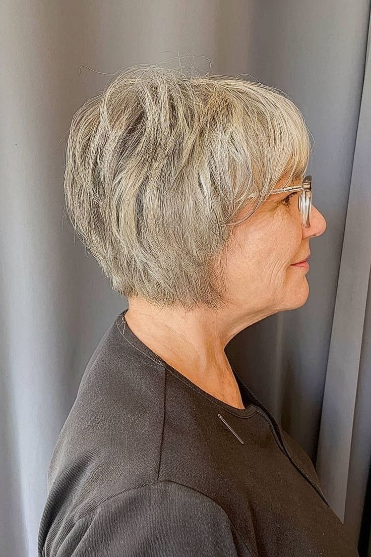 White layered wedge on a woman over 60, side view with glasses - wedge bob hairstyle