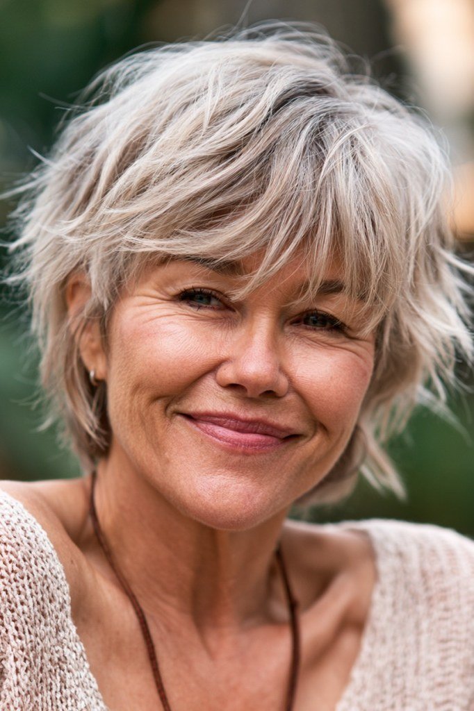 Gray shaggy wedge on a woman over 60, front view - wedge bob hairstyle