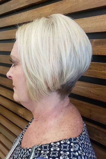 Platinum wedge on a woman over 60, side view - wedge bob hairstyle