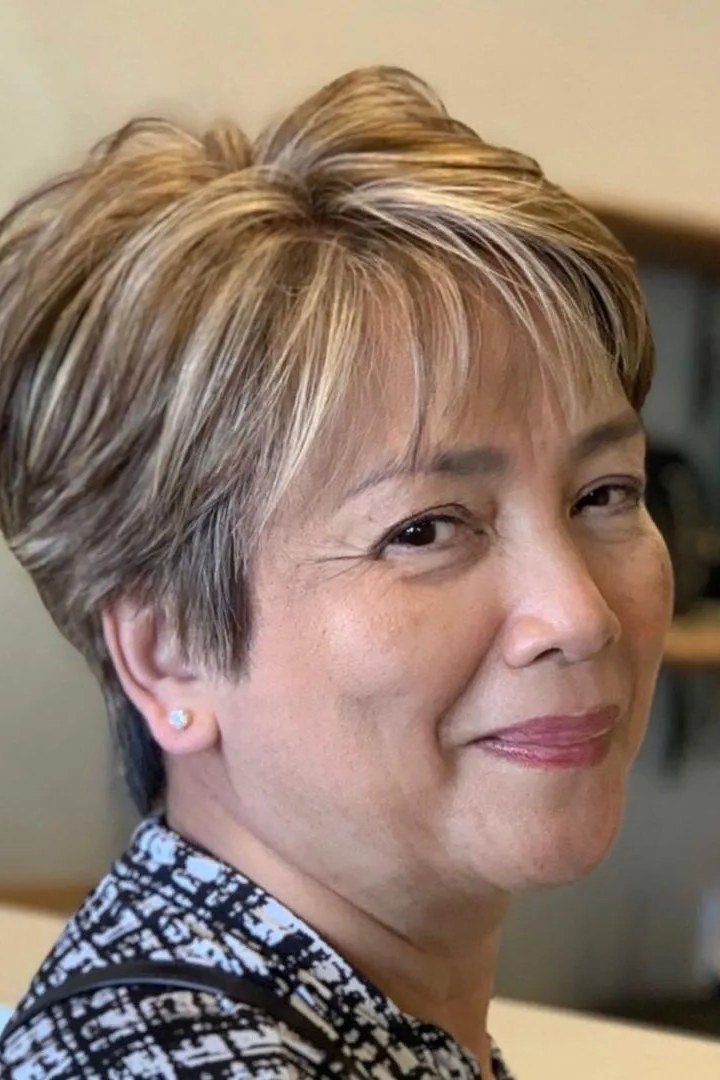 Blonde wedge on a woman over 60, front view - wedge bob hairstyle