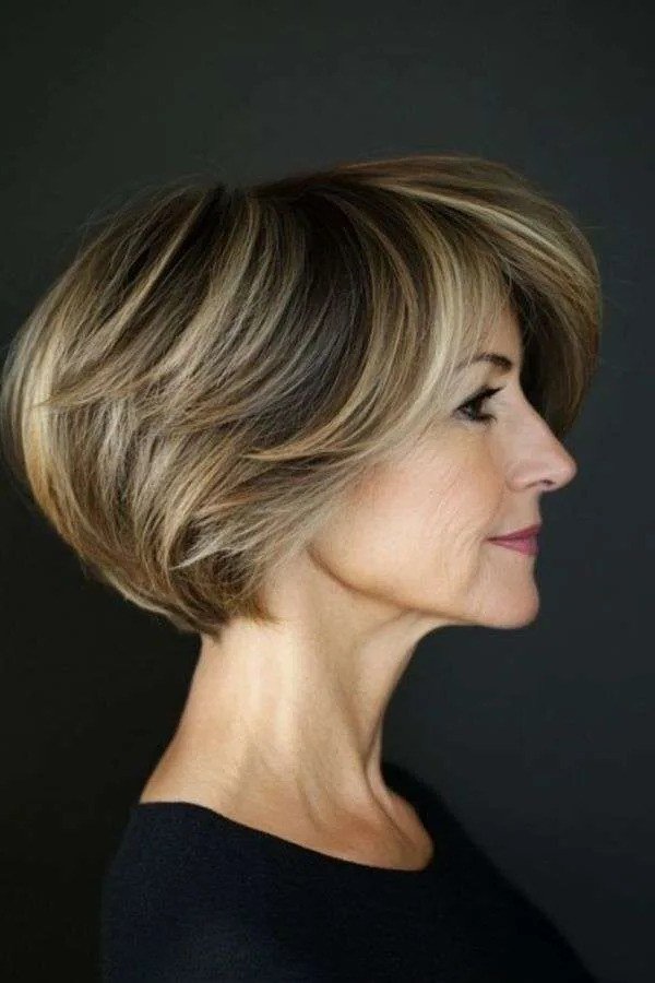 Brunette wedge on a woman over 60, side view - wedge bob hairstyle