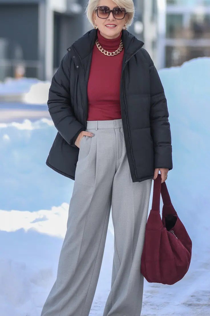 Black Puffer with Red Turtleneck in Snow winter outfit for women over 50