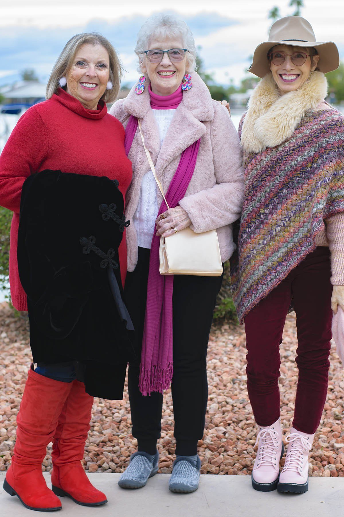 Winter outfit for women over 60: olive sweater, leopard pleated skirt, street
