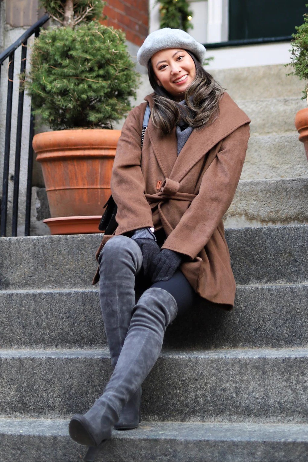 Brown Puffer Jacket on the Steps - winter coat outfit for women over 60
