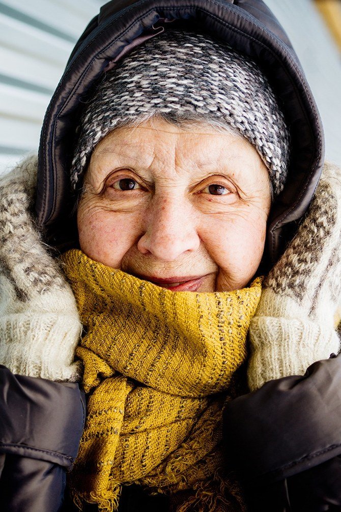 Black Puffer With Mustard Knit Scarf - winter outfit for women over 70 (black coat)