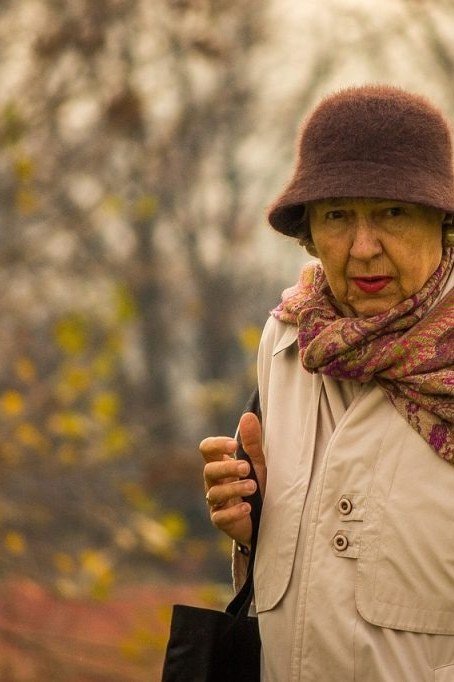 Beige Coat With Paisley Scarf and Bucket Hat - winter outfit for women over 70 (brown bucket hat)