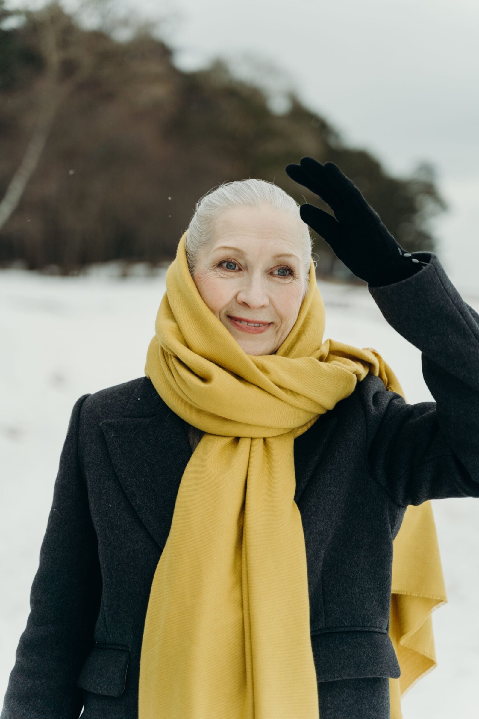 Black Coat With a Long Golden Yellow Scarf - winter outfit for women over 70 (black coat)